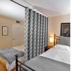 imageHVERSAILTEX Extra Wide Blackout Curtain 100x84 Inches Thermal Insulated Curtain for Sliding Glass Door Grommet Top Patio Door Curtain  Moroccan Tile Quatrefoil Pattern Teal and WhiteGrey  White